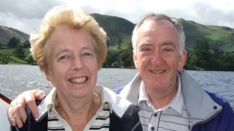 David Ensor/GFM Susan and David Ensor smiling whilst on a boat.