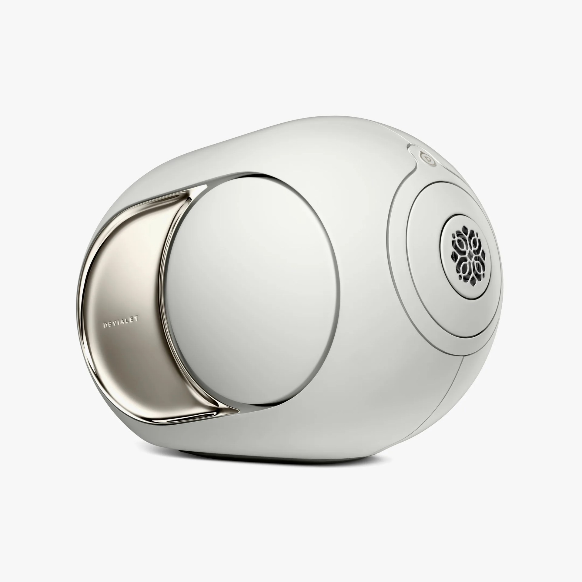 A sleek, modern white speaker with a rounded, futuristic design. It features a large circular driver on the side and a metallic accent plate with the brand name