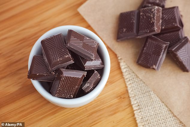 Dark chocolate contains compounds called flavonoids, which increase blood flow to the brain and prevent damage (stock image)