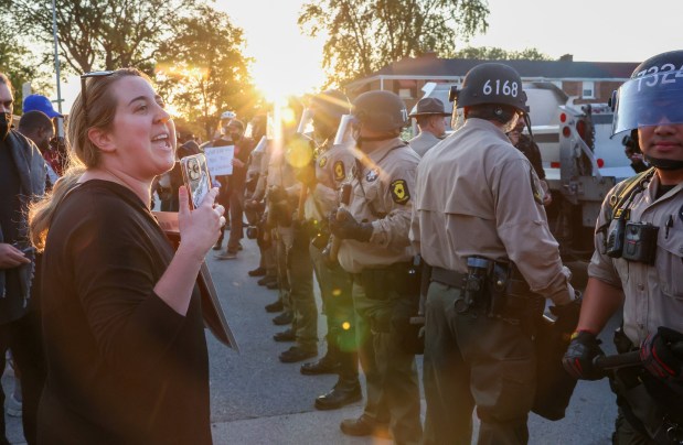 Protesters confront Illinois State Police troopers outside the U.S. Immigration and Customs Enforcement holding facility in Broadview on Oct. 3, 2025. (Stacey Wescott/Chicago Tribune)