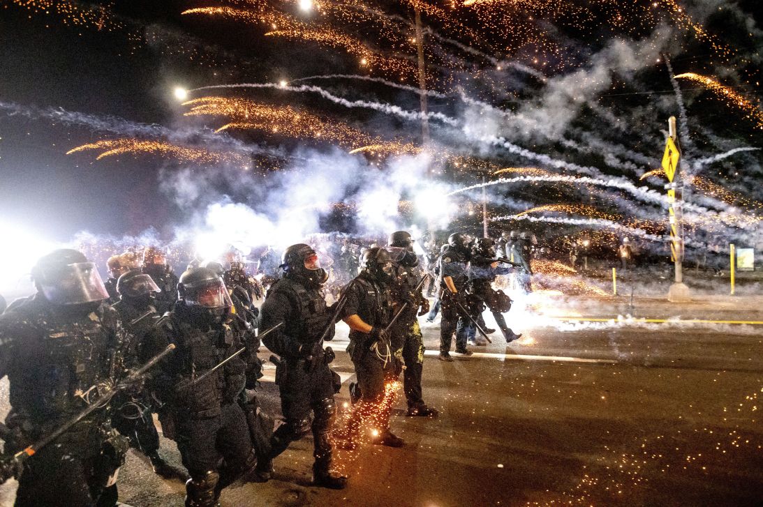 Police use chemical irritants and crowd control munitions to disperse protesters September 5 in Portland.