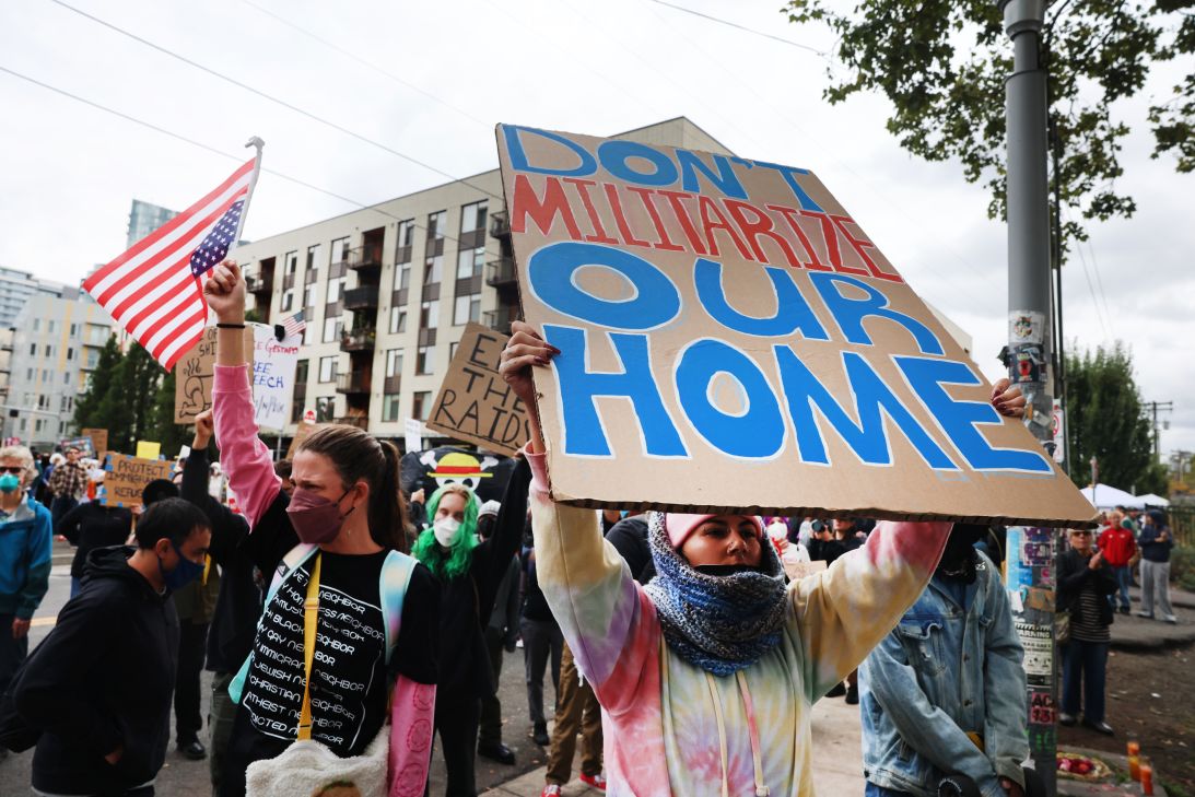 Protesters gather outside of an ICE facility on October 4, in Portland.